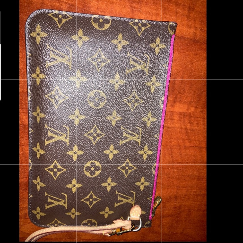 Louis Vuitton Brown Wristlet Monogram with handle. (Authentic )